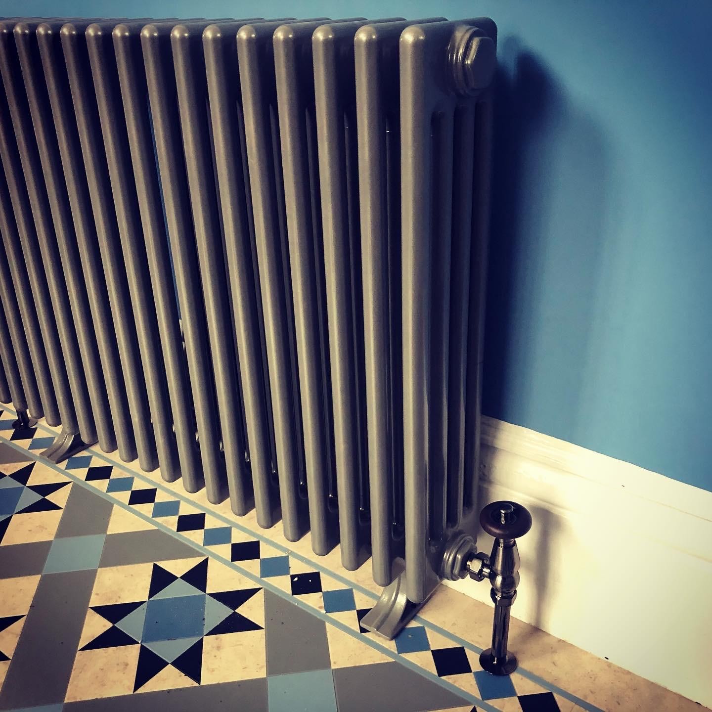 Close-up of a period cast iron radiator valve fitted during a Manchester radiator installation